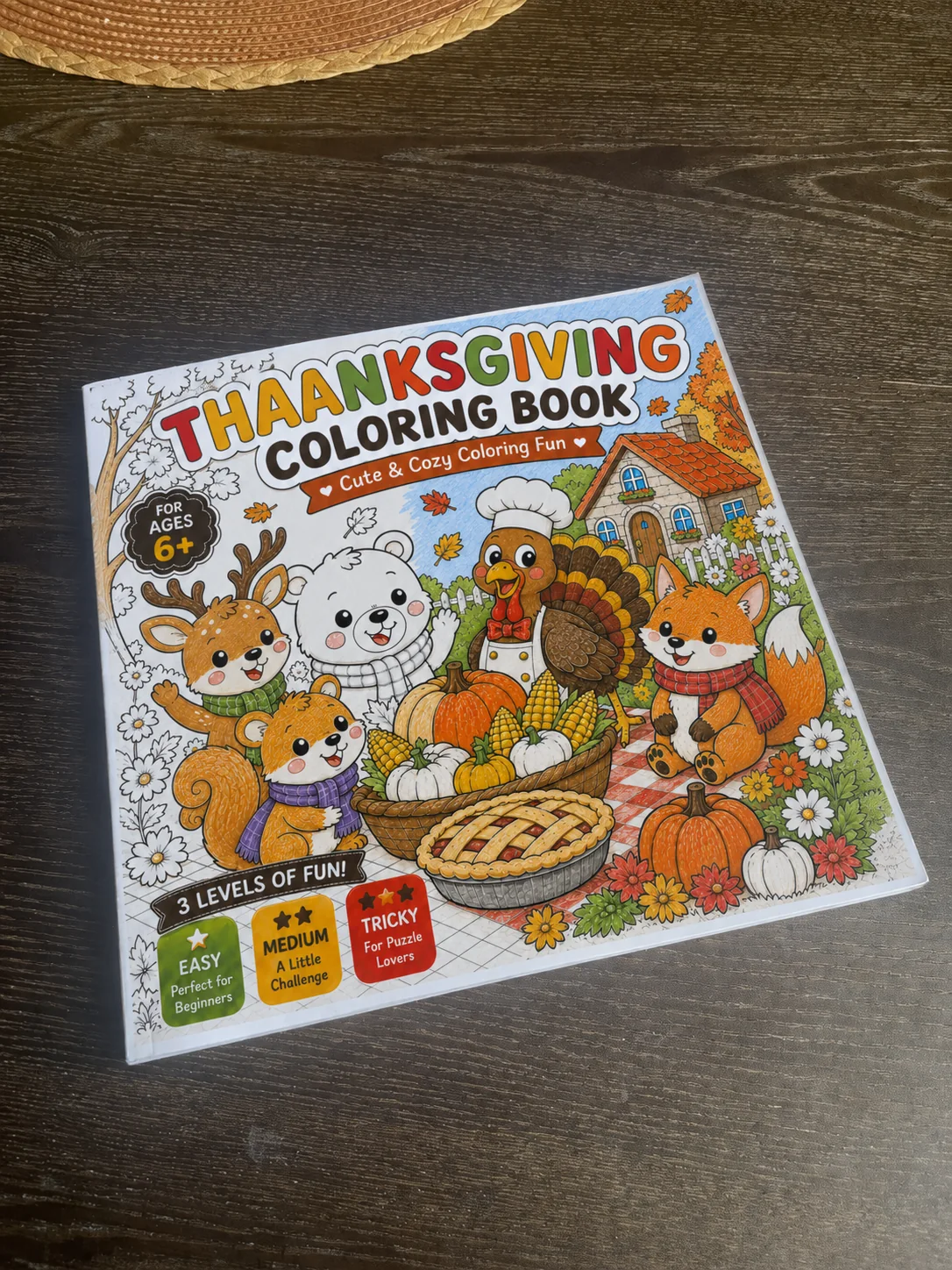 Thanksgiving Coloring Book on a wooden table
