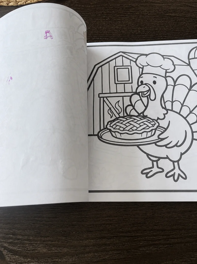 Black-and-white coloring page with a turkey and pie